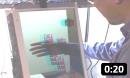 This video shows a research prototype system that demonstrates a behind display interaction method. Anaglyph based 3D rendering (colored glasses) and face tracking for view dependent rendering creates the illusion of dices sitting on top of a physical box. A depth camera is pointed at the users hands behind the display, creating a 3D model of the hand. Hand and virtual objects interact using a physics engine. The system allows users to interact seamlessly with both real and virtual objects. <br><br>
		This video, together with a short paper, was presented at the MVA 2011 conference (12th IAPR Conference on Machine Vision Applications, Nara, Japan, June 13-15, 2011).<br><br>
		Please note that this video is not 3D itself: the virtual content appears to the glasses wearing user as behind the display, where (from his perspective) they sit on a physical box.